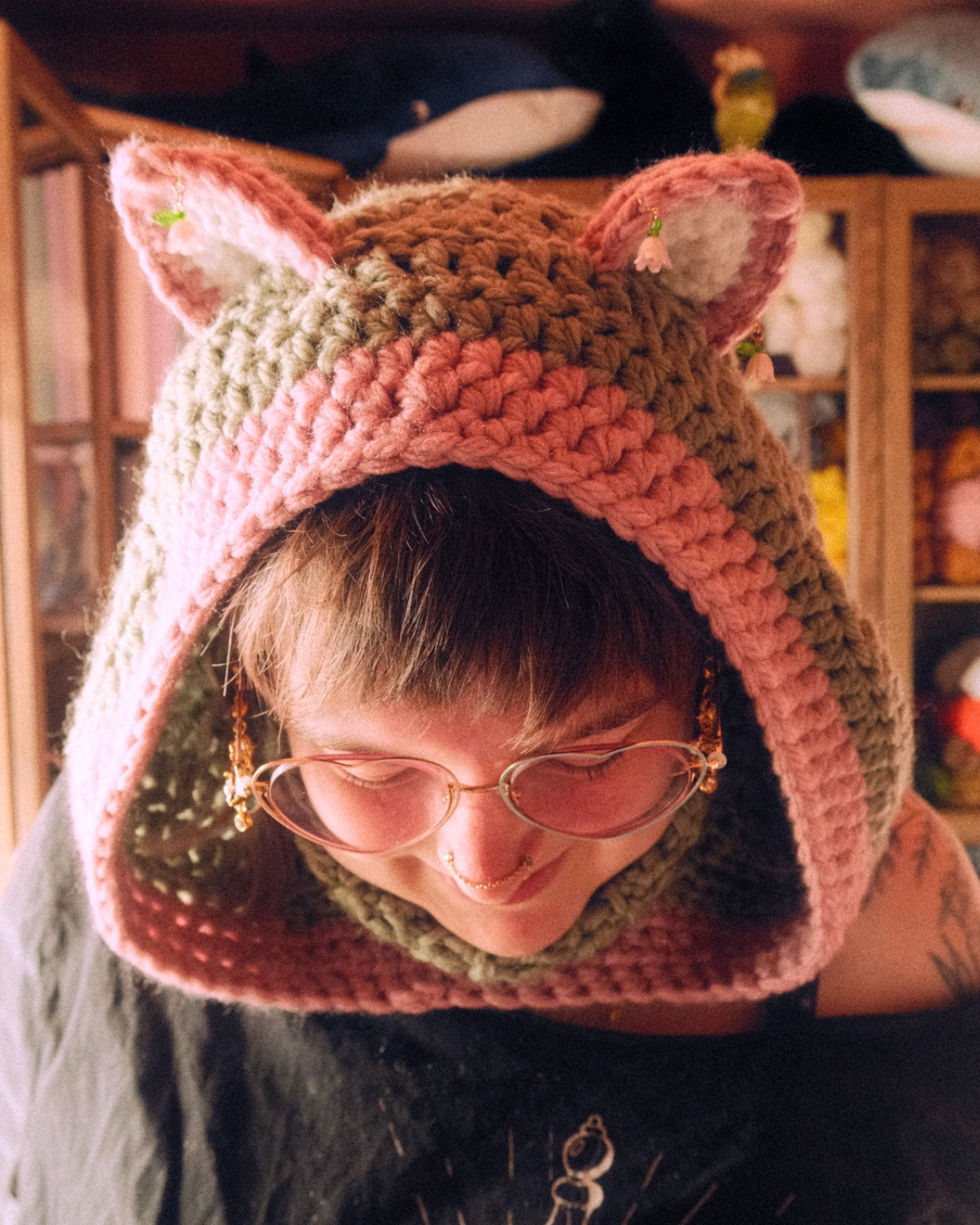 person wearing crochet cat hood with ears
