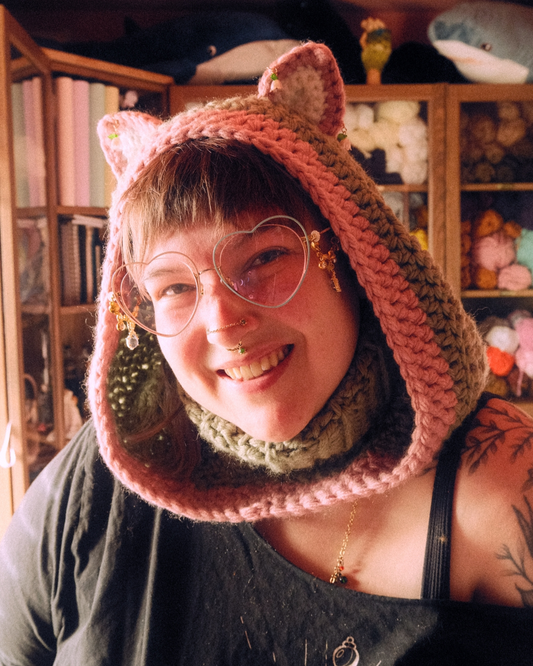 person wearing crochet cat hood with ears