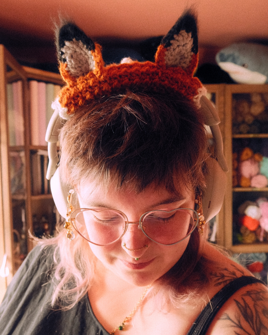person wearing headphones with fox ears attached