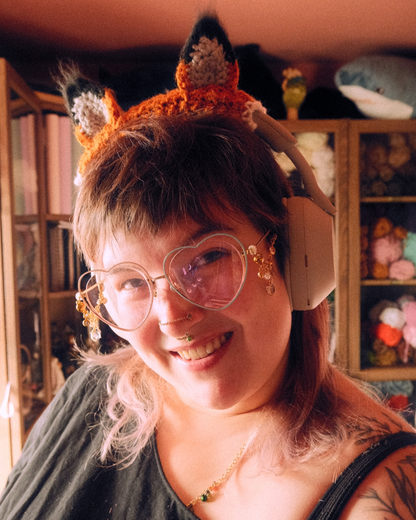 person wearing headphones with fox ears attached